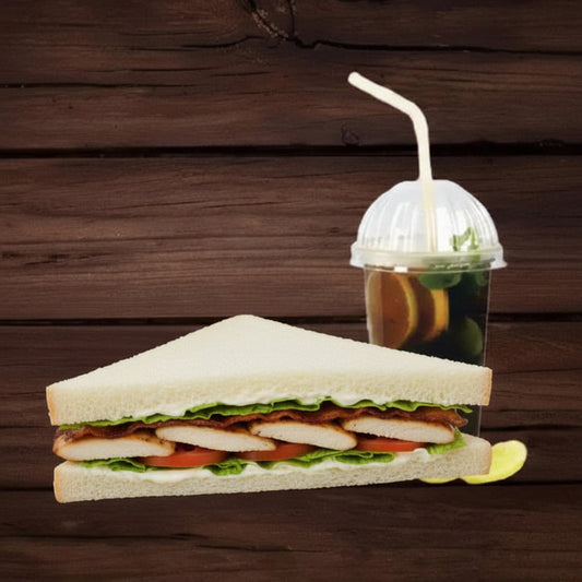 sandwich and a drink with a straw on a wooden surface